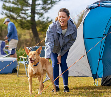 family-camping-with-their-dog